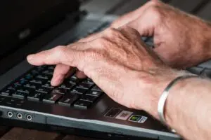 elderly man at computer